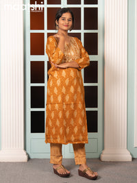 Rayon readymade salwar suit dark mustard with allover butta prints & embroidery sequin work neck pattern and straight cut pant