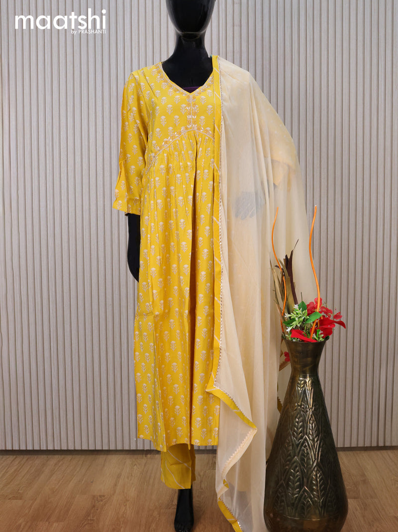 Modal readymade party salwar suit yellow with allover prints & alia cut beaded work neck pattern and straight cut pant & chiffon dupatta