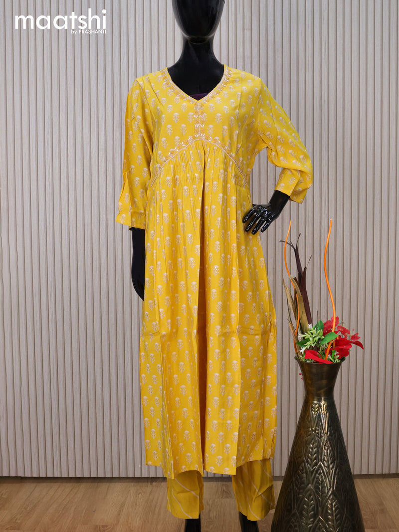 Modal readymade party salwar suit yellow with allover prints & alia cut beaded work neck pattern and straight cut pant & chiffon dupatta