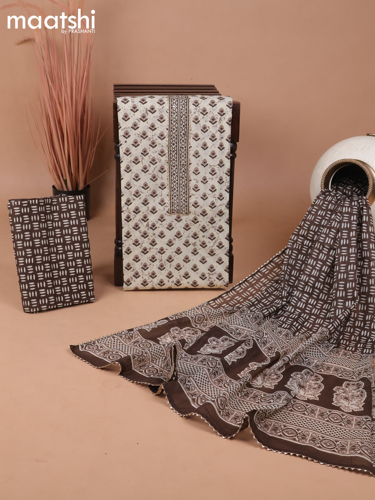Cotton dress material cream and brown with ikat butta prints & patch work neck pattern and bottom & gottapatti lace work dupatta