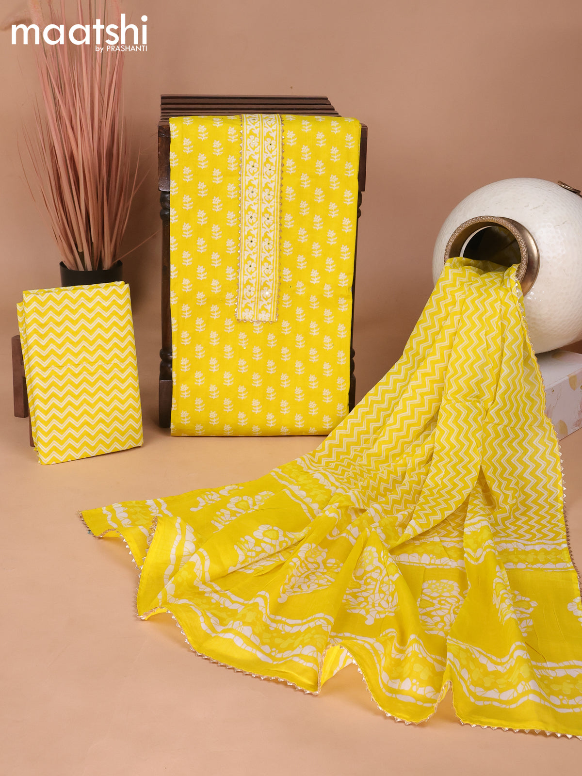 Cotton dress material yellow with floral butta prints & patch work neck pattern and bottom & gottapatti lace work dupatta