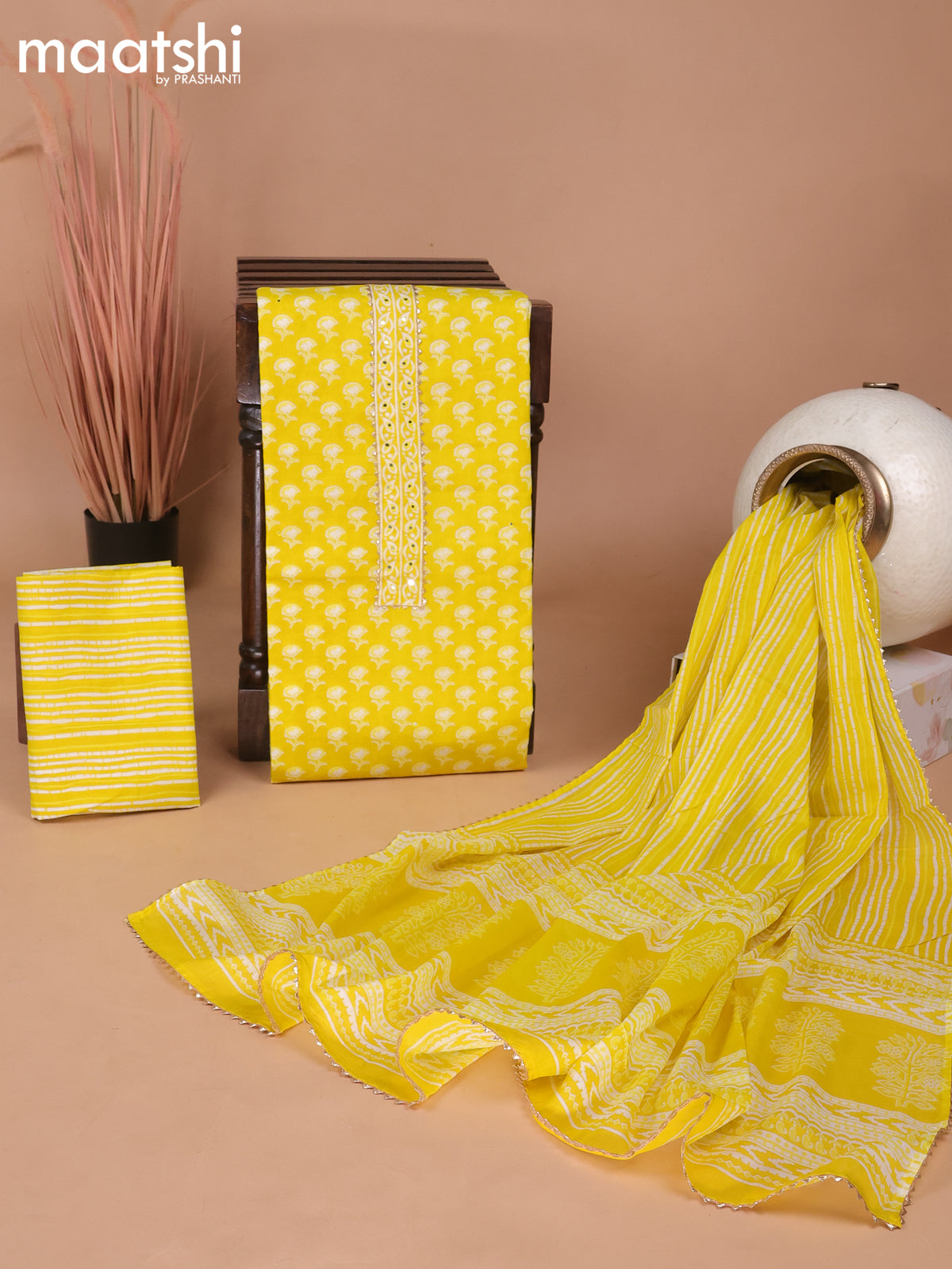 Cotton dress material yellow with floral butta prints & patch work neck pattern and bottom & gottapatti lace work dupatta