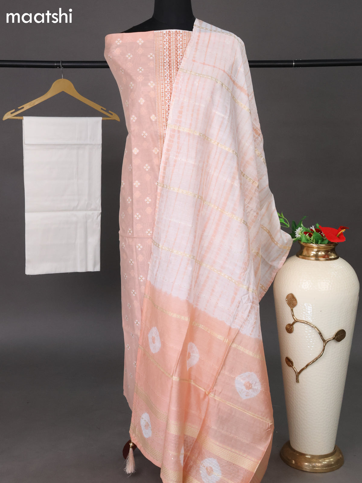 Chanderi dress material peach shade and off white with woven buttas & embroidery work neck pattern and bottom & sequin work dupatta