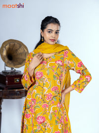 Cotton salwar suit mustard yellow with allover floral prints & mirror pita work and straight cut pant & dupatta