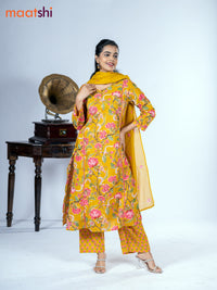 Cotton salwar suit mustard yellow with allover floral prints & mirror pita work and straight cut pant & dupatta
