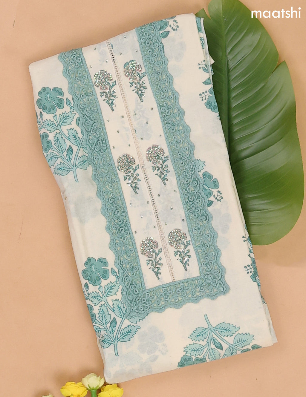 Off White and Teal Green Cotton Dress Materials With Floral Buttas and Lace Work Pattern
