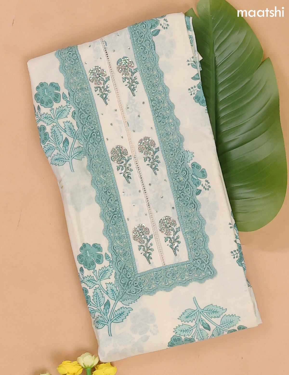 Off White and Teal Green Cotton Dress Materials With Floral Buttas and Lace Work Pattern
