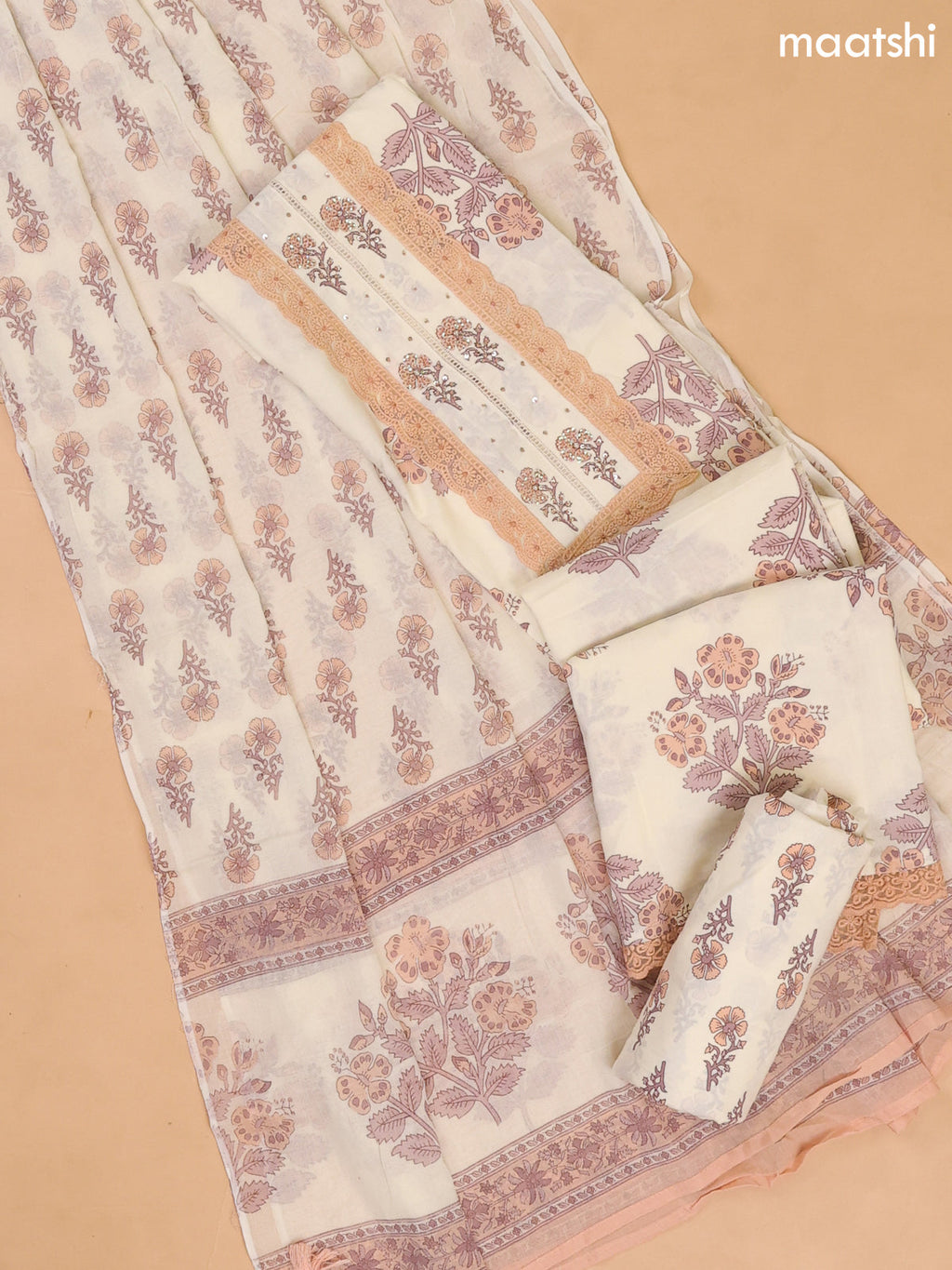 Cream and Peach Cotton Dress Materials With Floral Buttas and Lace Work Pattern