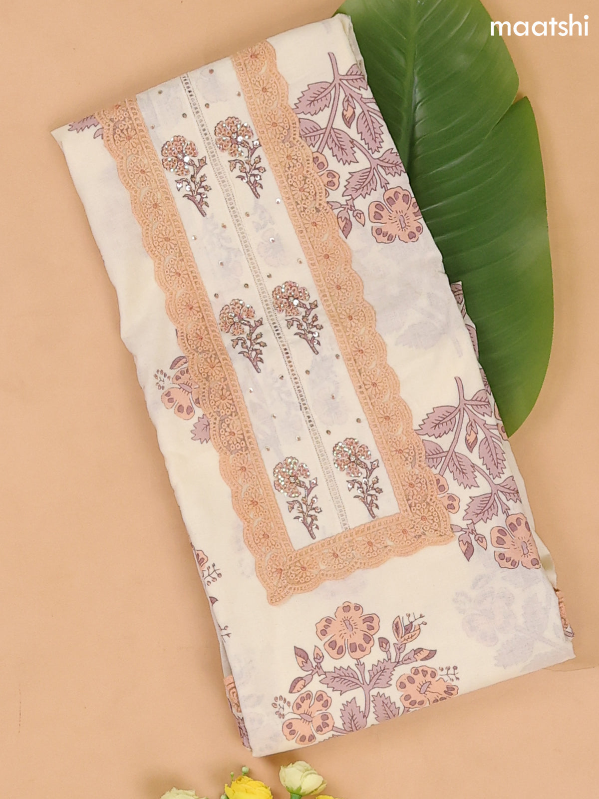 Cream and Peach Cotton Dress Materials With Floral Buttas and Lace Work Pattern