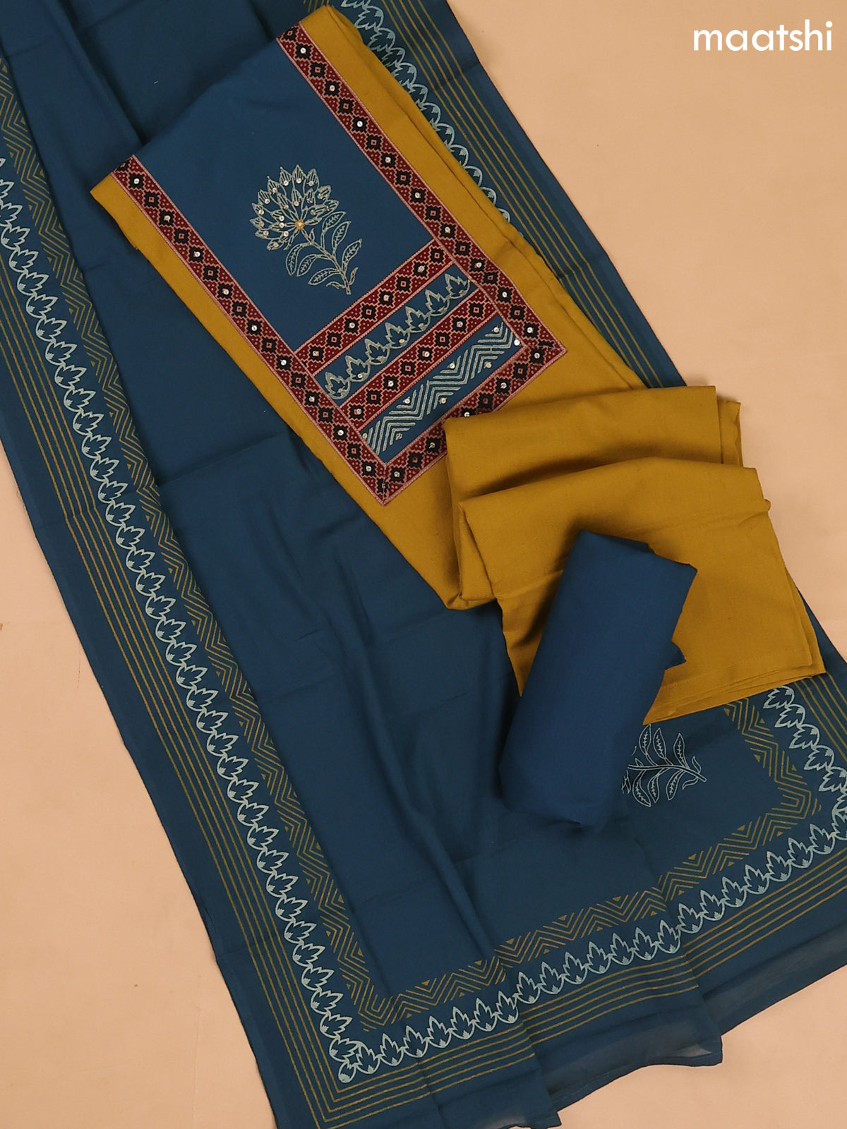 Musted Yellow and Peacock Blue Cotton Dress Materials With Patch Work Neck Pattern
