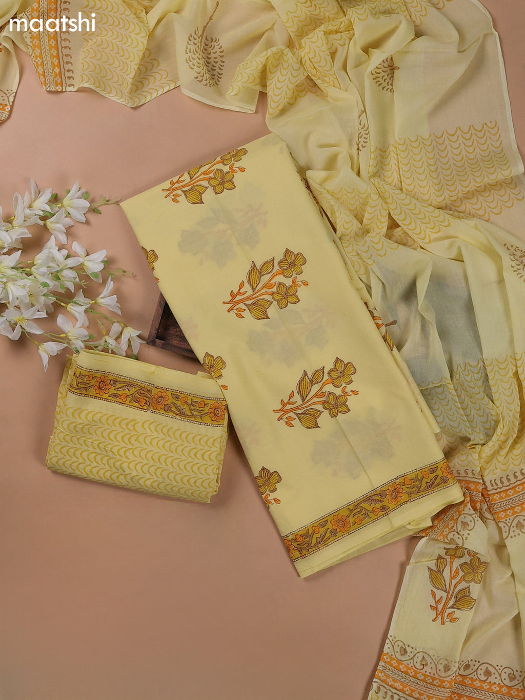 Pale Yellow Mulmul Cotton Dress Materials With Floral Butta Weaves
