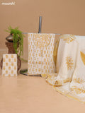 Off White and Mustard Cotton Dress Material With Allover Floral Prints and Lace Work Neck Pattern and Bottom & Dupatta