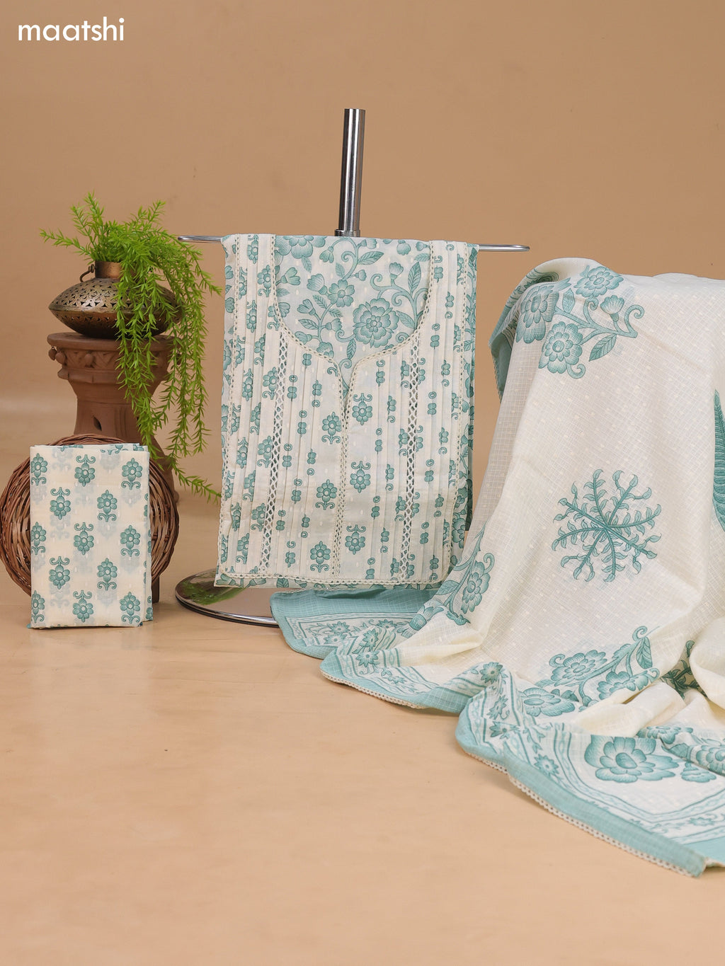 Off White and Teal Green Cotton Dress Material With Allover Floral Prints and Lace Work Neck Pattern and Bottom & Dupatta