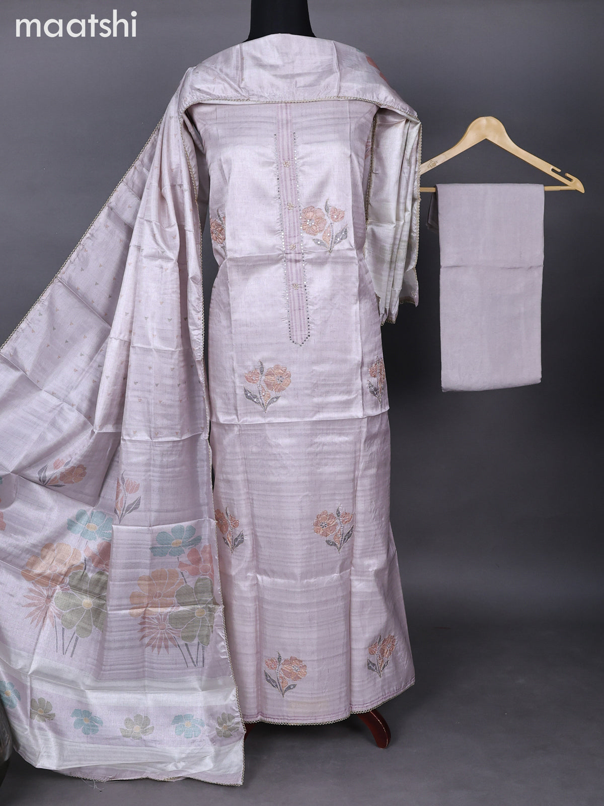 Semi tussar dress material mild pastel lavender with allover floral prints & simple neck pattern and bottom & printed dupatta