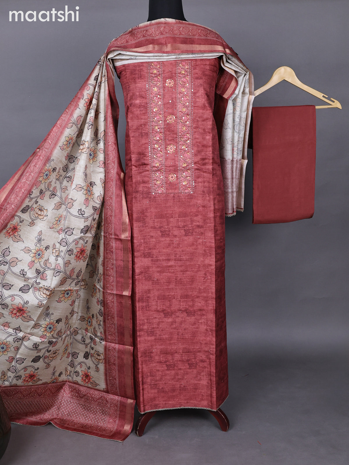 Semi tussar dress material rust shade with allover prints & sequin embroidery work neck pattern and bottom & kalamkari prints dupatta