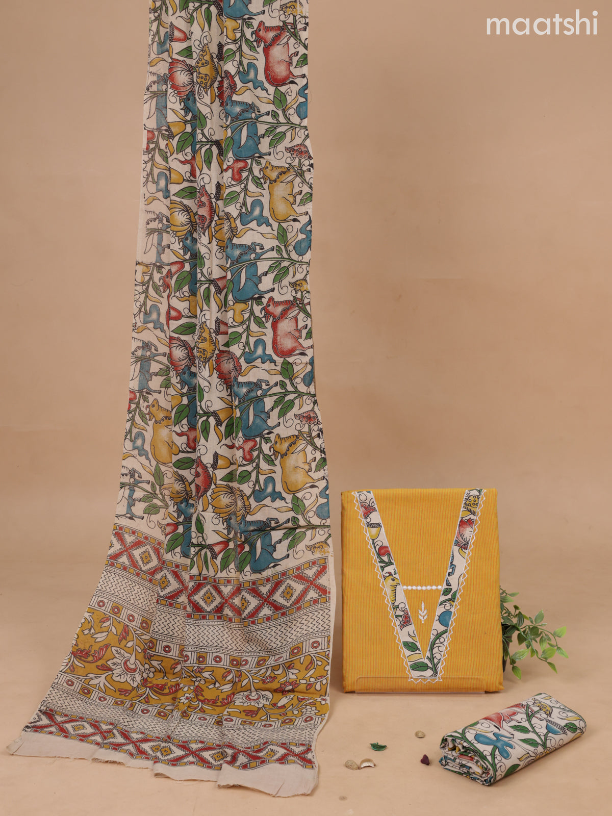 Cotton dress material mustard yellow and beige with patch work V neck patteren and bottom & kalamkari printed dupatta
