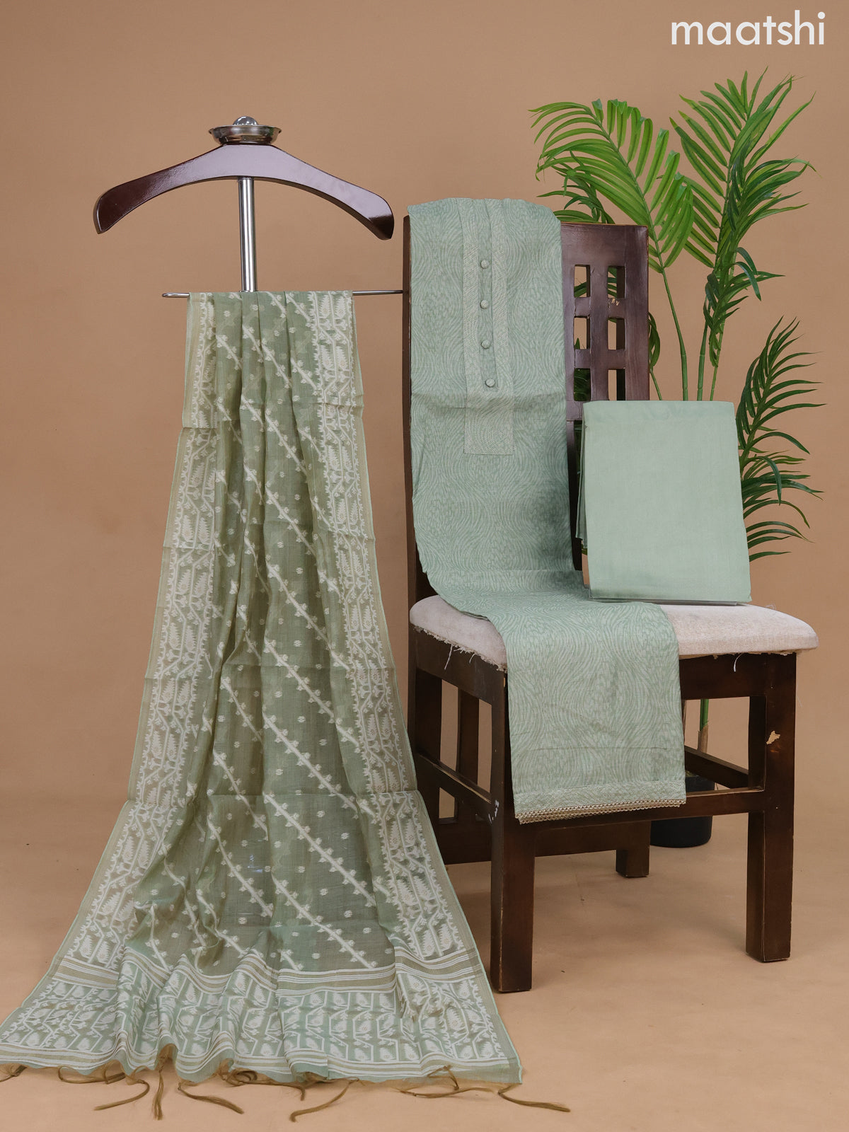 Semi tussar dress material pastel green with allover prints & simple neck pattern and bottom & dupatta