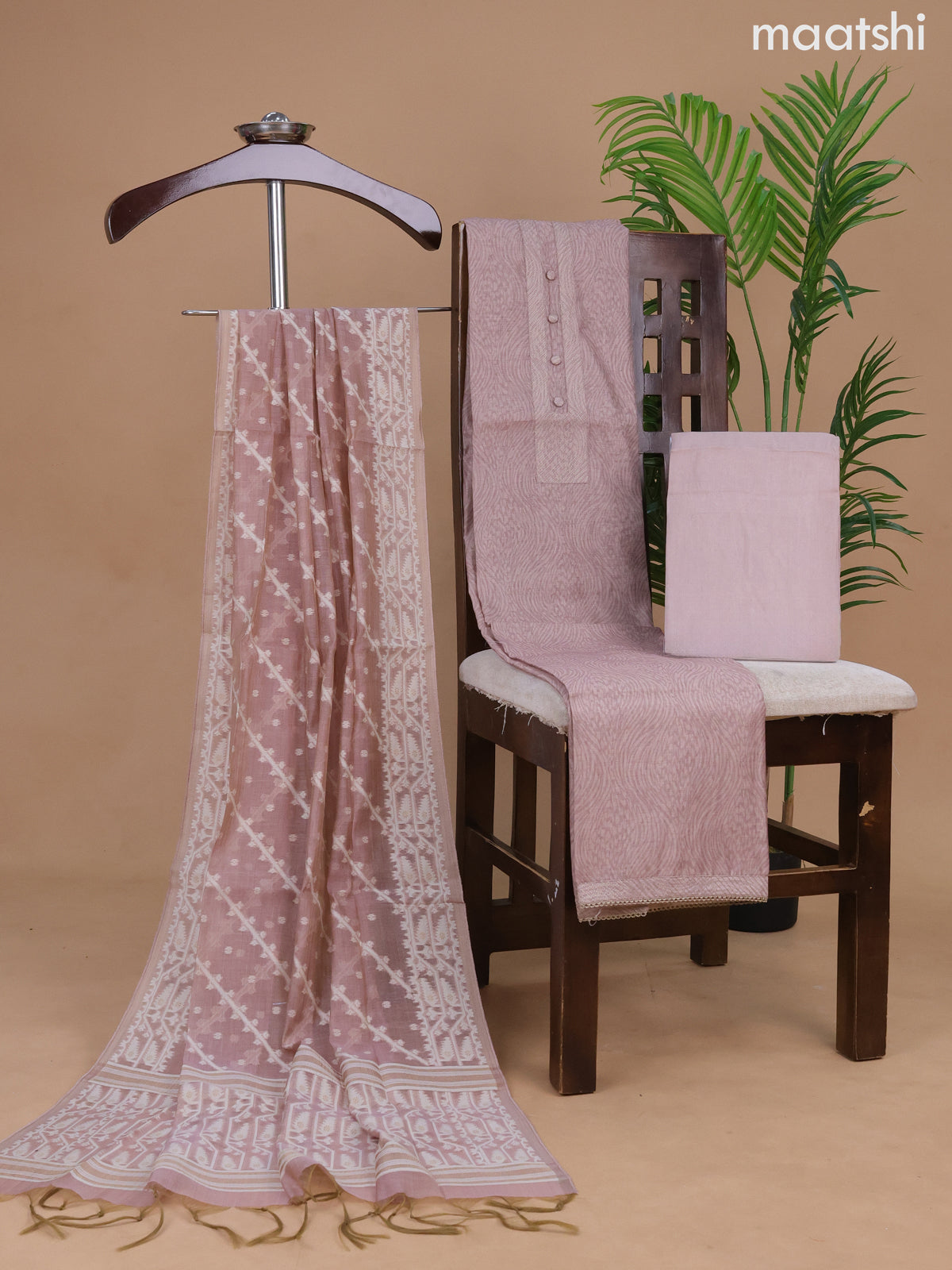 Semi tussar dress material pastel peach shade with allover prints & simple neck pattern and bottom & dupatta