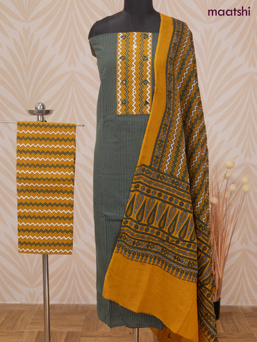 Cotton dress material dark green and mustard yellow with allover thread weaves & patch work neck pattern and bottom & dupatta