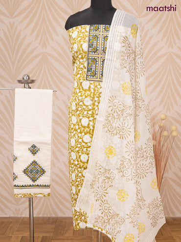 Cotton dress material lime green and off white with allover prints & patch work neck pattern and bottom & dupatta
