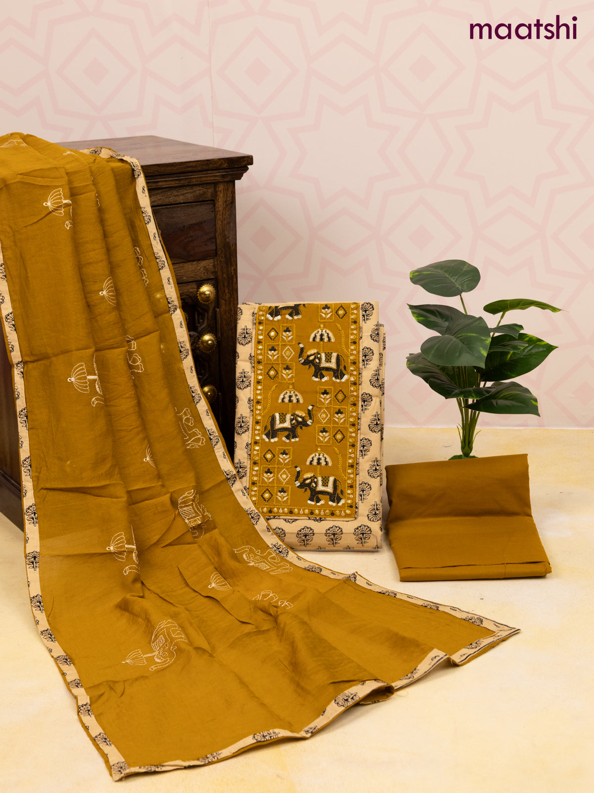 Cotton dress material sandal and dark mustard with allover butta prints & patch work neck pattern and bottom & dupatta