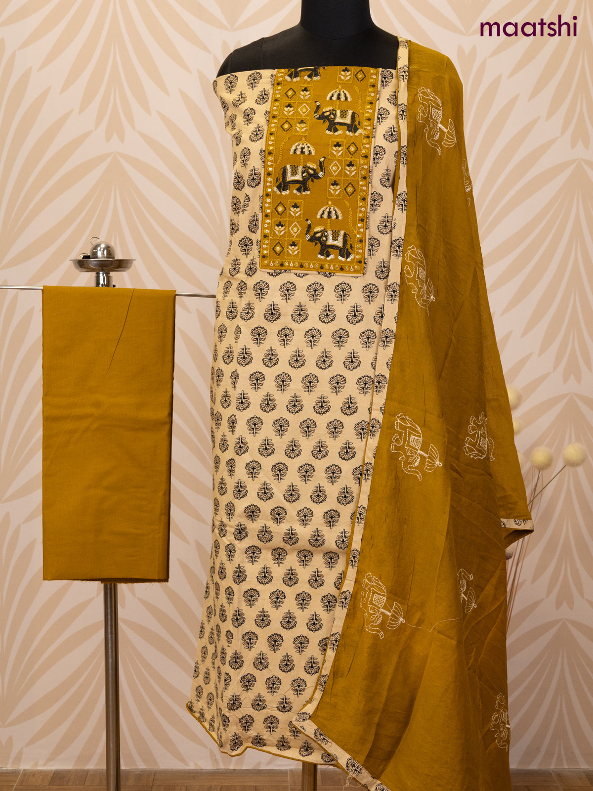 Cotton dress material sandal and dark mustard with allover butta prints & patch work neck pattern and bottom & dupatta