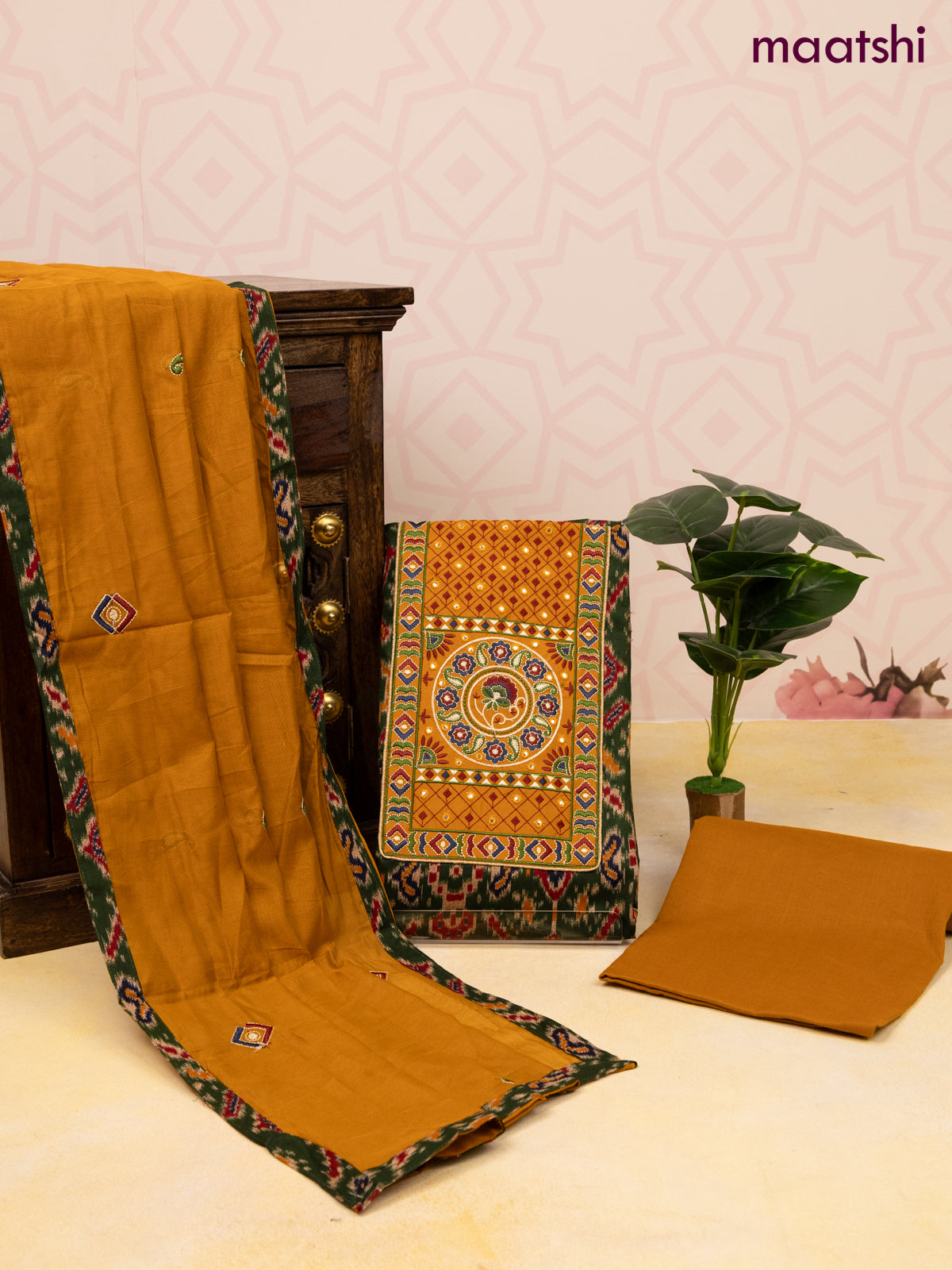 Cotton dress material dark green and dark mustard with allover ikat prints & patch work neck pattern and bottom & dupatta