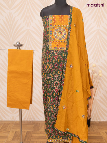 Cotton dress material dark green and dark mustard with allover ikat prints & patch work neck pattern and bottom & dupatta