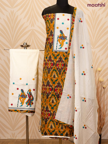 Cotton dress material dark msutard and off white with allover ikat prints & patch work neck pattern and bottom & dupatta