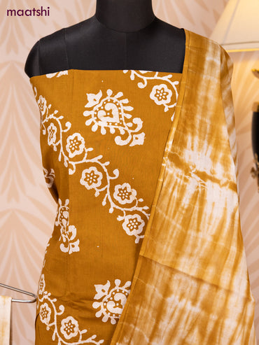Batik cotton dress material dark mustard and off white with batik prints and bottom & dupatta