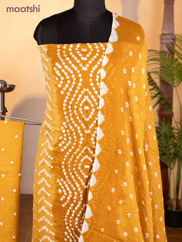 Bandhani dress materials dark mustard and mustard shade with allover bandhani prints and bottom & dupatta