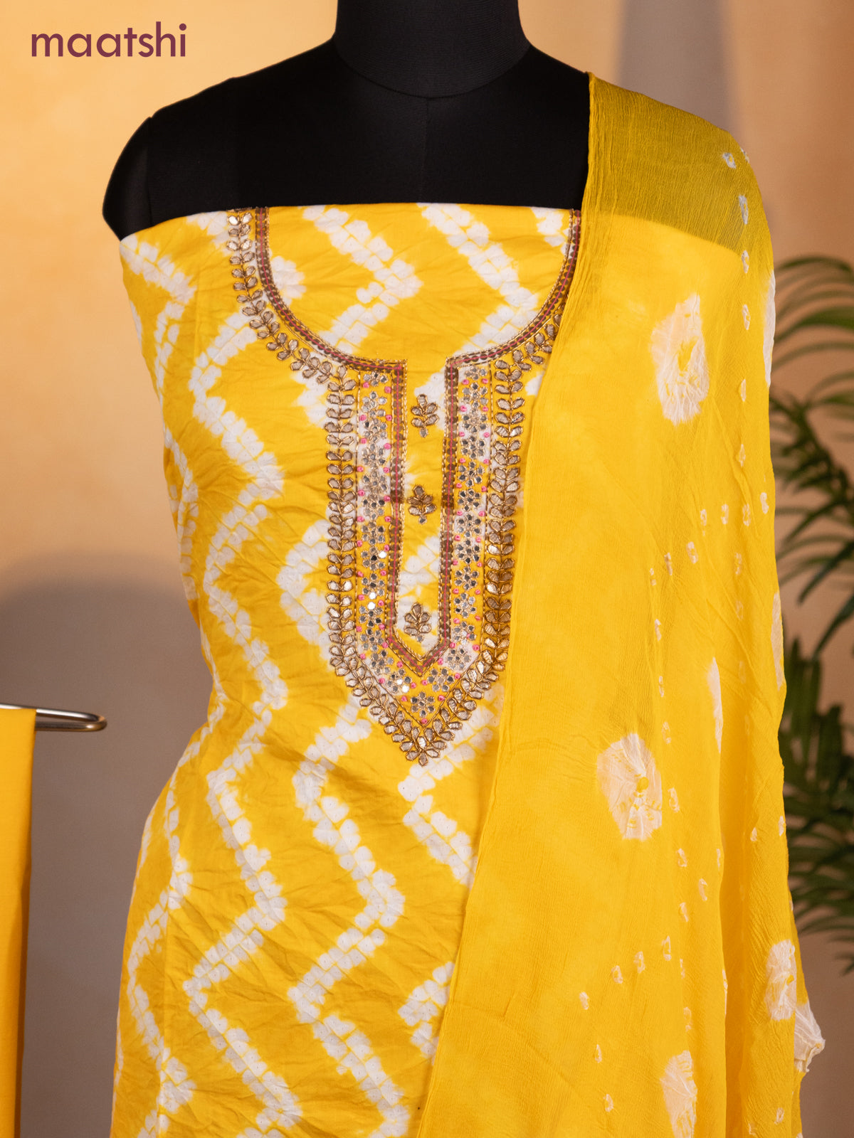 Bandhani dress materials mango yellow with shibori prints & zardosi work neck pattern and bottom & chiffon dupatta