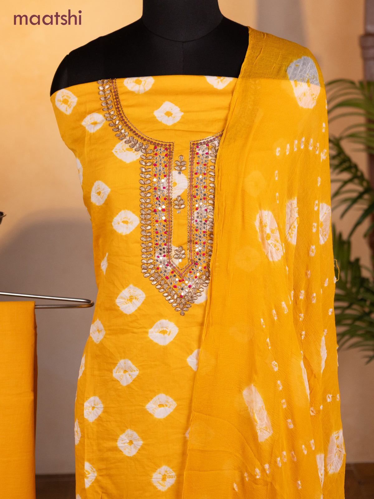 Bandhani dress materials mango yellow with bandhani prints & zardosi work neck pattern and bottom & chiffon dupatta