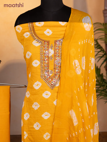 Bandhani dress materials mango yellow with bandhani prints & zardosi work neck pattern and bottom & chiffon dupatta