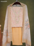 Linen cotton dress material cream and pale orange with allover floral prints & embroidery mirror work neck pattern and bottom & dupatta