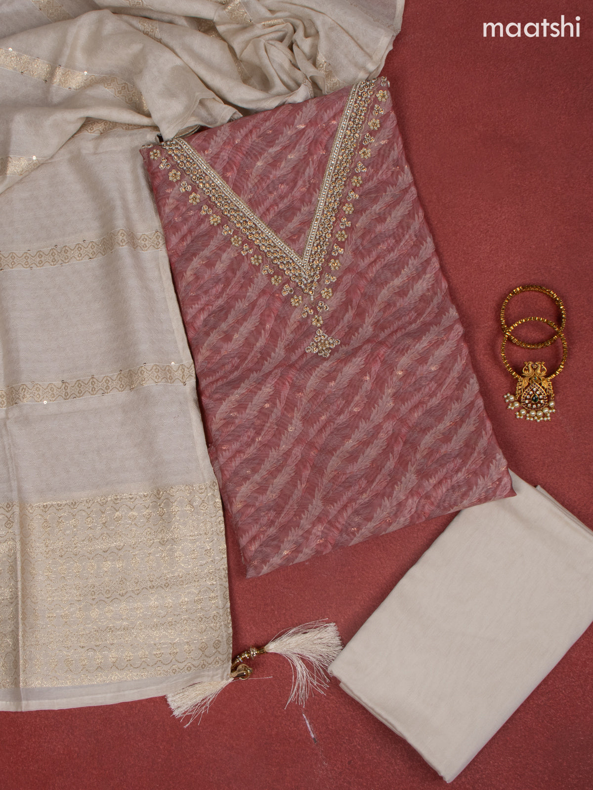 Raw Silk dress material peach shade with allover prints & beaded work v neck pattern and bottom & banarasi dupatta