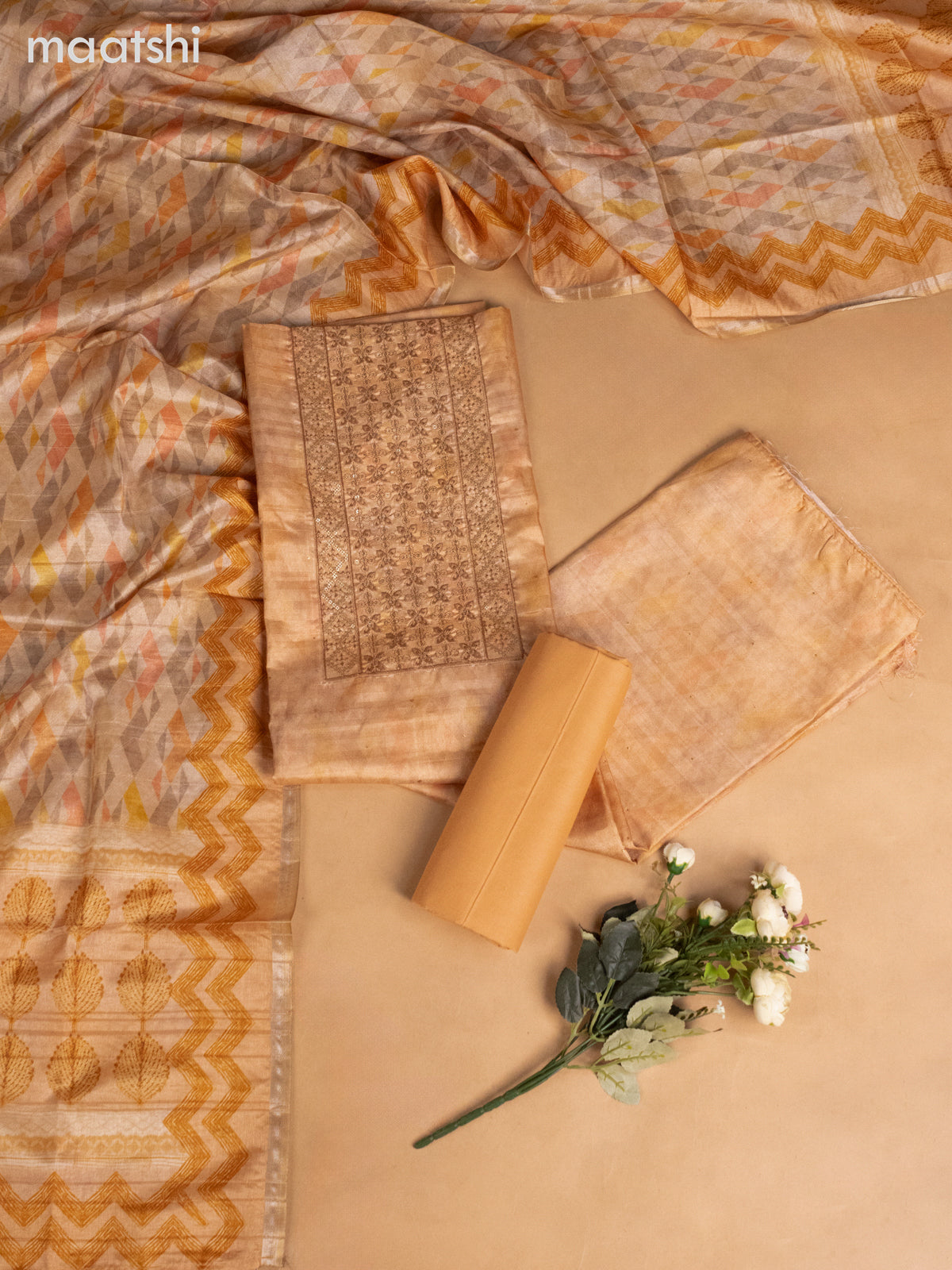 Semi tussar dress material pale orange with allover prints & sequin embroidery work neck pattern and bottom & dupatta
