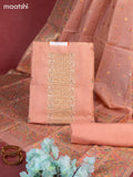 Munga cotton dress material peach shade with woven buttas & beaded zardosi work neck pattern and bottom & thread zari dupatta