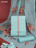 Linen dress material teal blue with allover prints & sequin embroidery work neck pattern and bottom & french knot dupatta