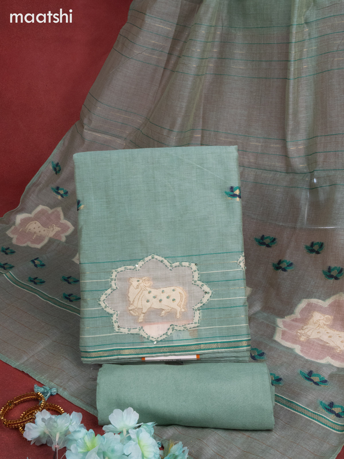 Munga cotton dress material teal shade with woven buttas & pichwai prints french knot work and bottom & thread zari dupatta