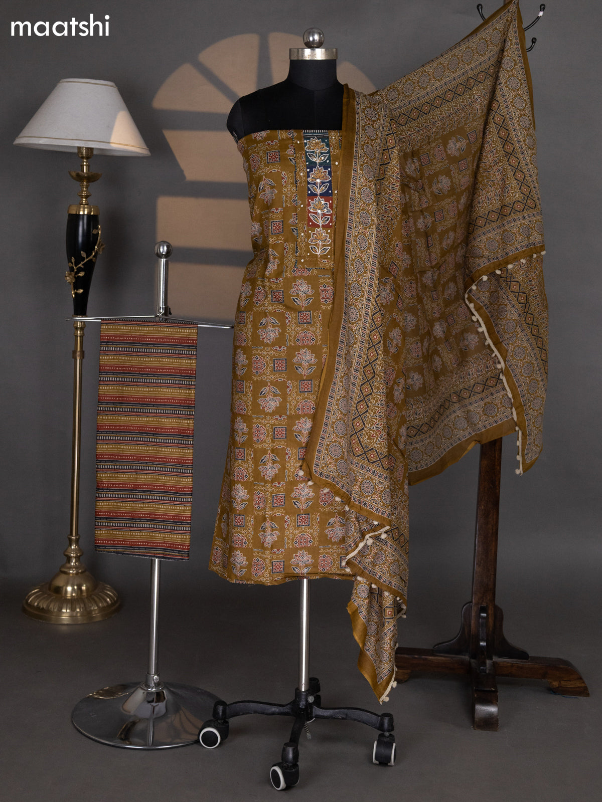 Dark Mehendi Green Cotton Dress Material With Allover Ajrakh Prints & Embroidery Work Neck Pattern and Bottom & Dupatta