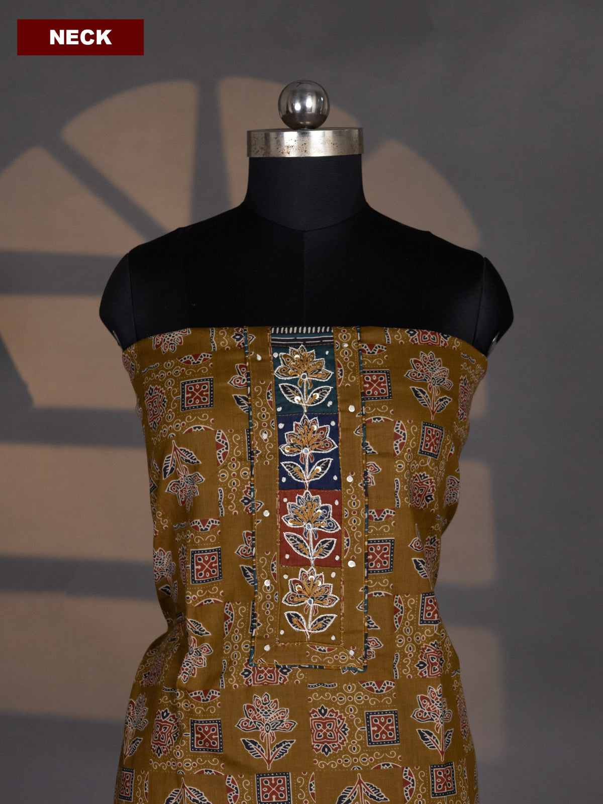 Dark Mehendi Green Cotton Dress Material With Allover Ajrakh Prints & Embroidery Work Neck Pattern and Bottom & Dupatta