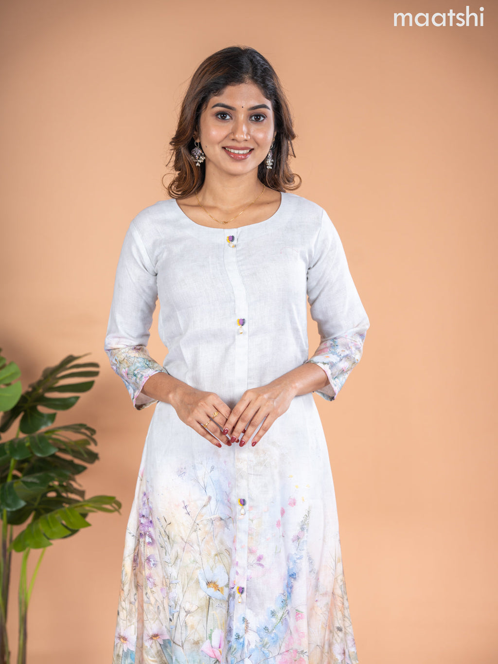 Rayon A-line kurti mild pista green with placement prints & simple neck pattern without pant