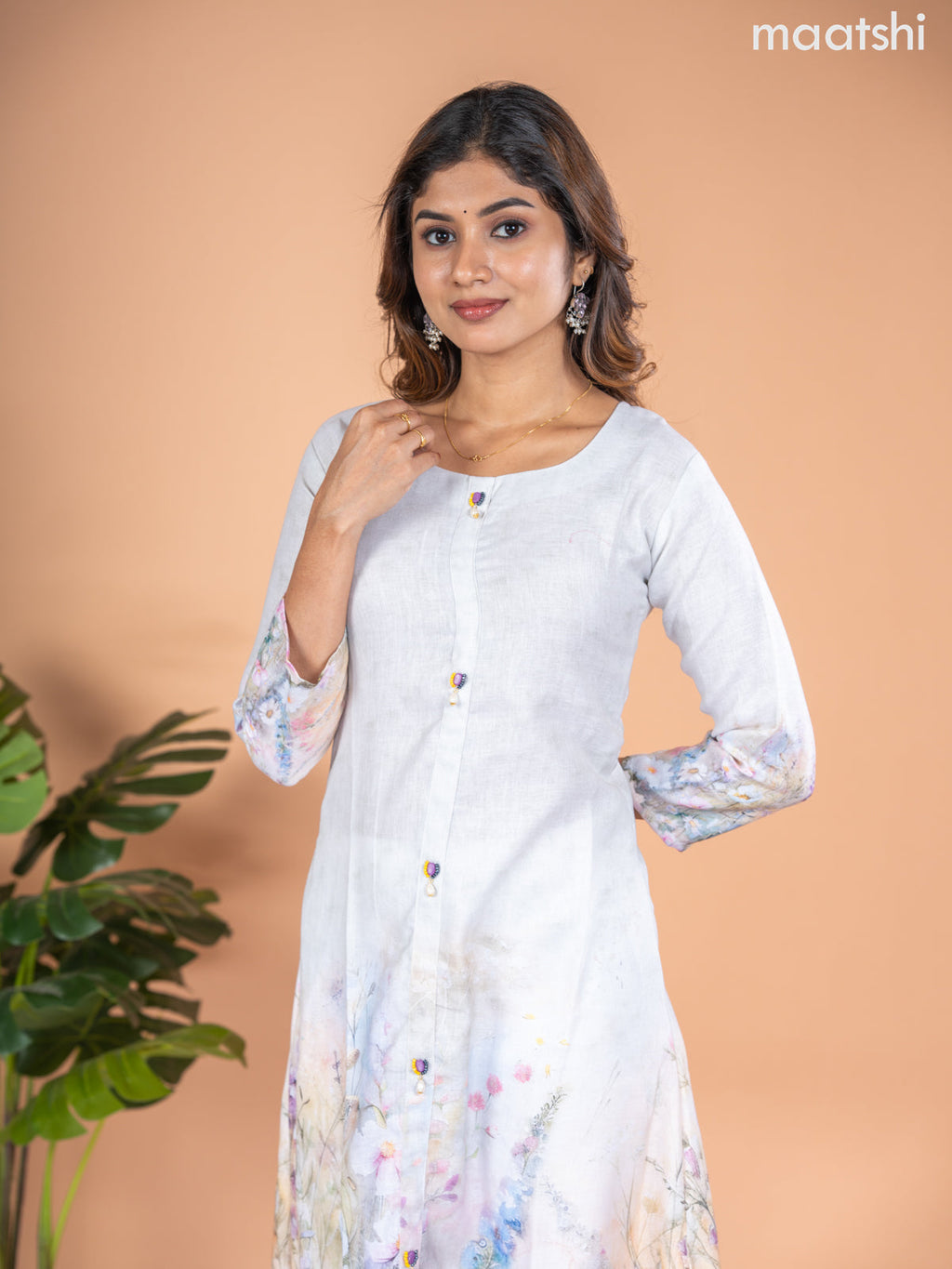 Rayon A-line kurti mild pista green with placement prints & simple neck pattern without pant