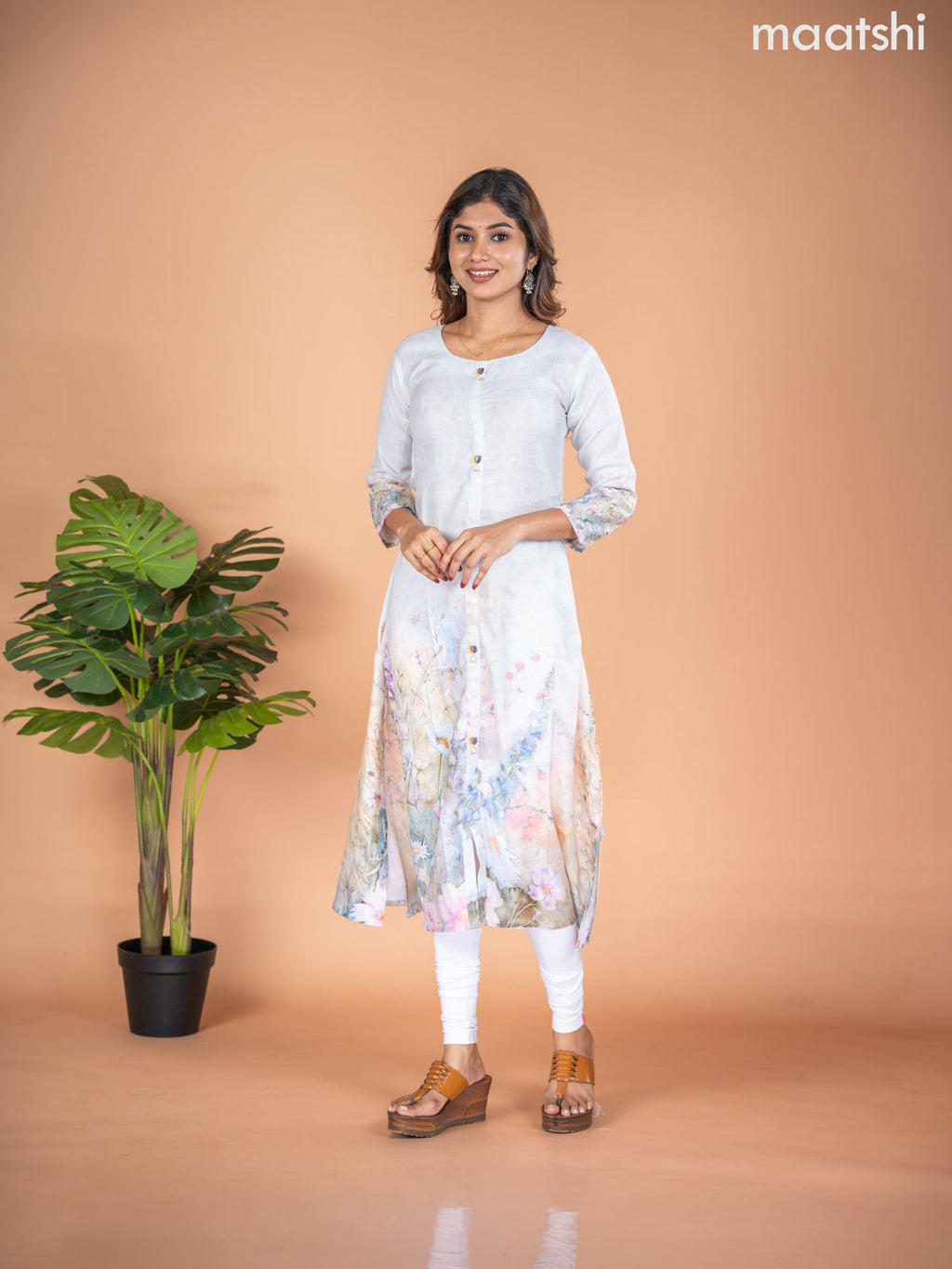 Rayon A-line kurti mild pista green with placement prints & simple neck pattern without pant