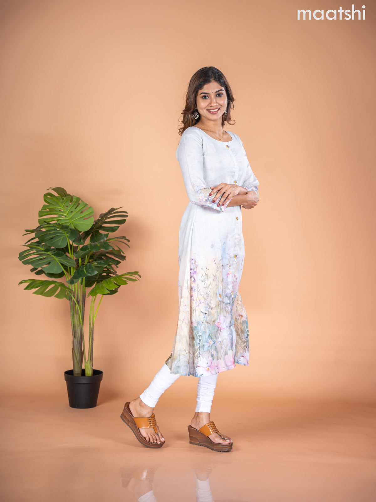 Rayon A-line kurti mild pista green with placement prints & simple neck pattern without pant