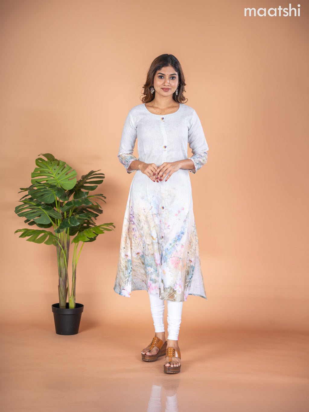 Rayon A-line kurti mild pista green with placement prints & simple neck pattern without pant