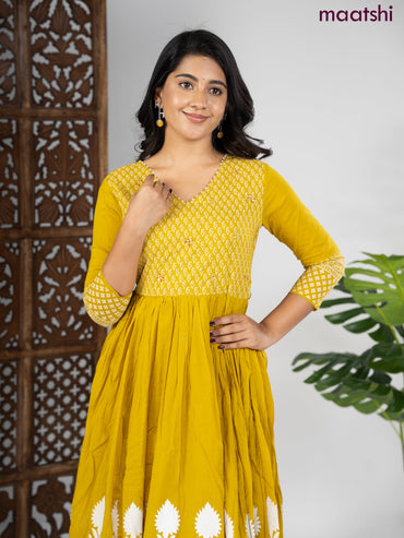 Cotton anarkali kurti mustard shade and off white with prints & beaded work v neck pattern without pant
