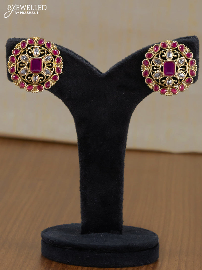 Light weight floral design earrings with ruby and white stones