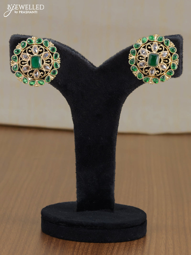 Light weight floral design earrings with emerald and white stones